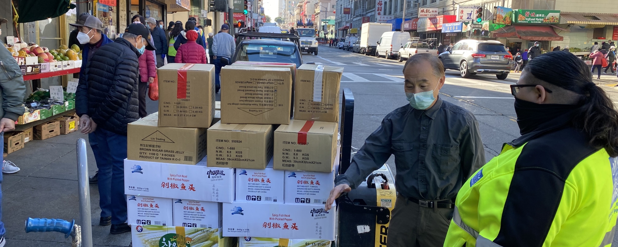 picture of chinatown vendors being educated about cleanup