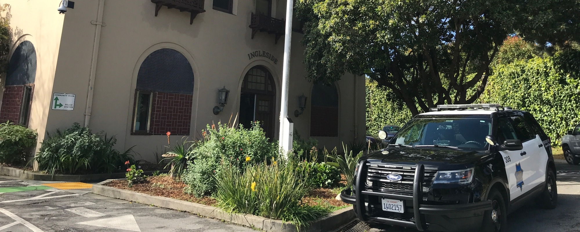 The Ingleside Police Station with a police cruiser parked in front of it. 